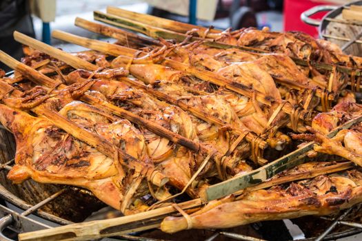 grilled chicken sold by street food vendor