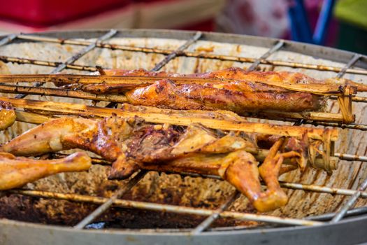 grilled chicken sold by street food vendor