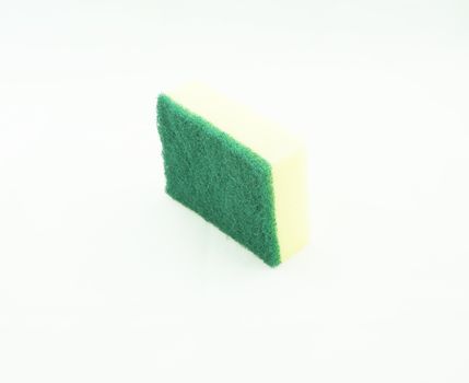 Dishwashing sponge has two sides, one rough green. another side is a yellow sponge.                               