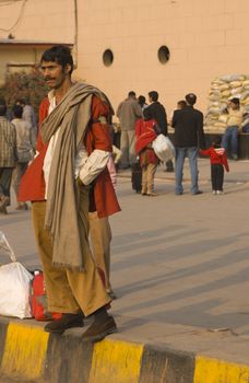 Porter outside New Delhi railway station in Delhi, India