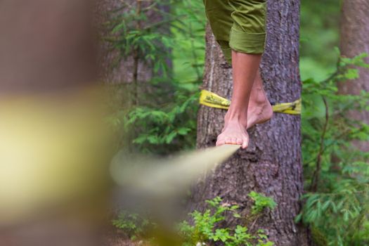Slacklining is a practice in balance that typically uses nylon or polyester webbing tensioned between two anchor points.