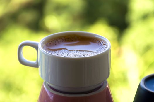 Summer Espresso on Green Leaves Background. Pattaya.