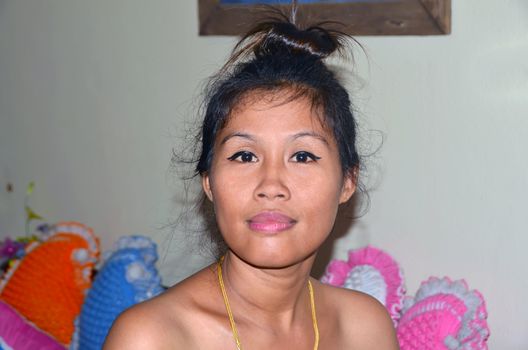 Question in Her Eyes. Thai Women Photo With Golden Chain.
