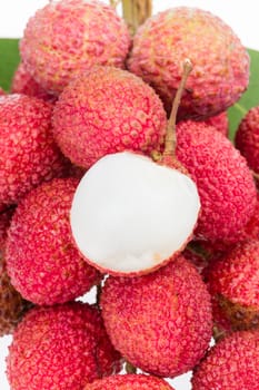 bunch of fresh lychee with leaf on white background