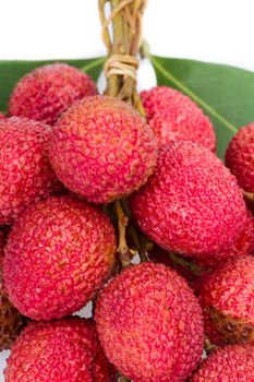 bunch of fresh lychee with leaf on white background