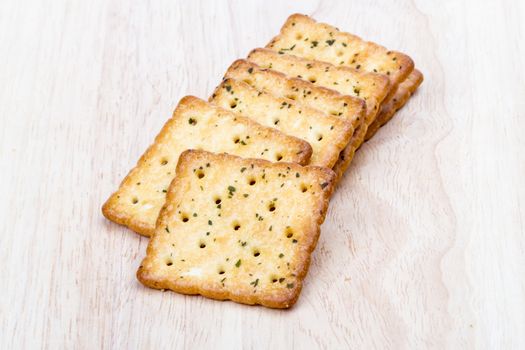 Vegetable cracker on wooden background