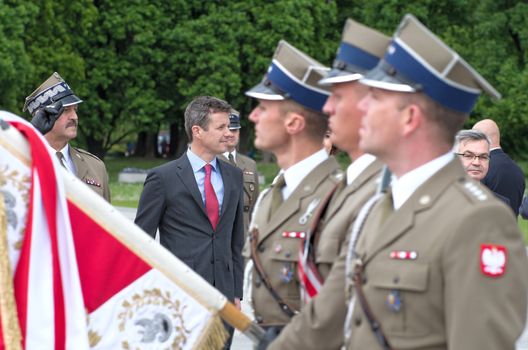 Warsaw, Poland - May 12, 2014: Danish Crown Prince Couple on state visit to Poland. Crown Prince Frederik at the military parade.