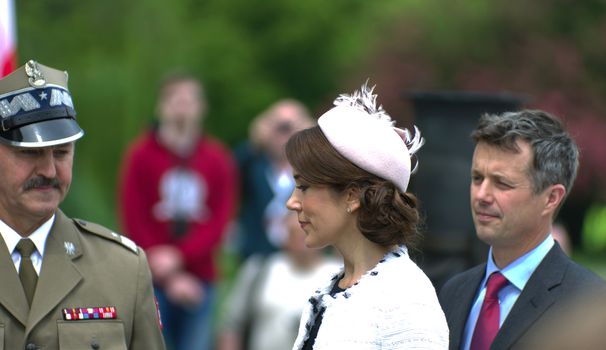 Warsaw, Poland - May 12, 2014: Danish Crown Prince Couple on state visit to Poland. Crown Prince of Denmark Frederik and Crown Princess Mary during the wreath laying ceremony.