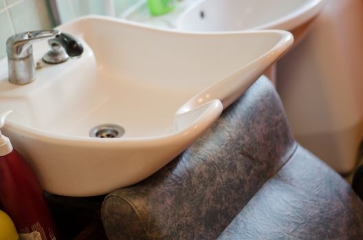 white ceramic sink at hairdressing salon