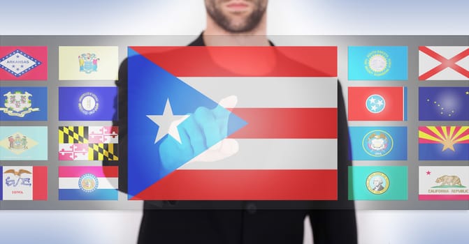 Hand pushing on a touch screen interface, choosing a state, Puerto Rico
