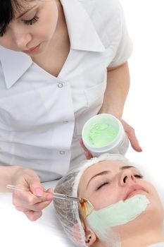 beauty salon, facial mask applying using brush