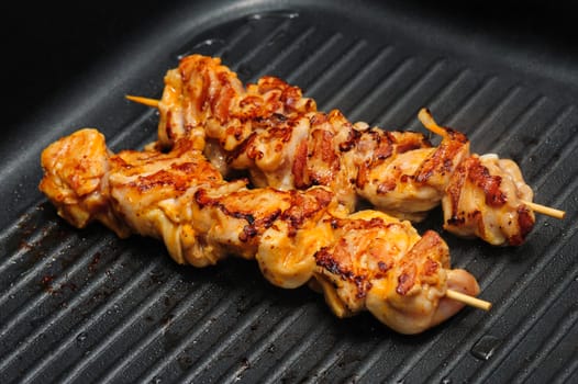 preparation of chicken shish kebab on skewers