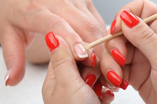 beauty salon, manicure applying, cleaning the cuticles