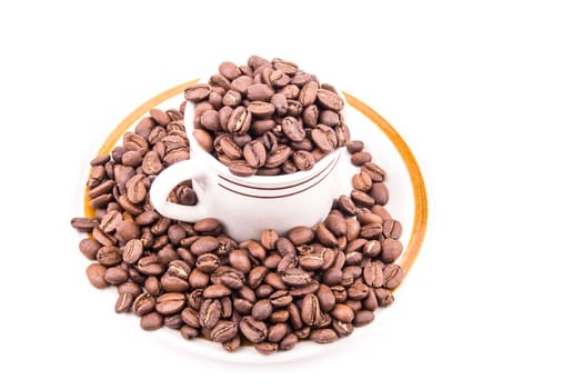 the beautiful roated coffee bean in the cup on the white background