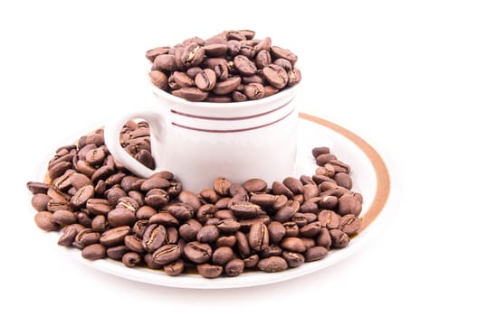 the coffee beans in the cup on the white background