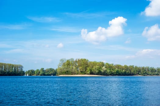 Altrhein near Bruehl (Kollerinsel), view of the Wurstinsel on a sunny day, clouds and blue sky