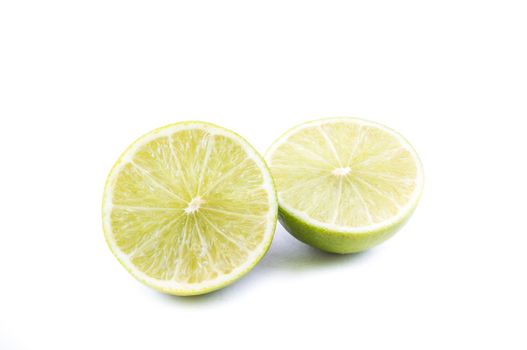 the cut of beautiful green lemon lime on the white background