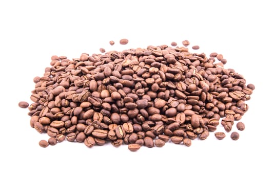 the pile of roasted coffee bean on the white background