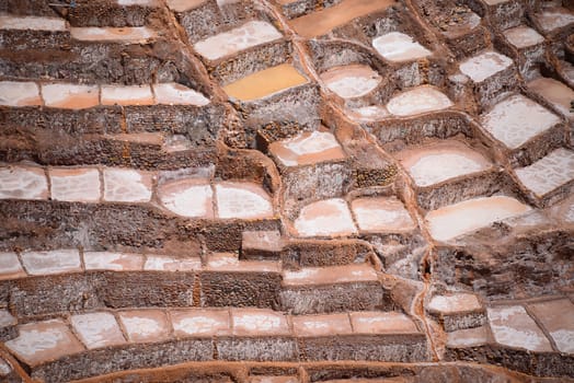 Inca ancient salt farm produced by evaporation in Peru