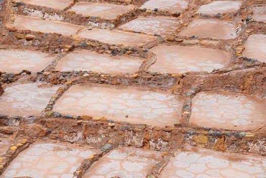 Inca ancient salt farm produced by evaporation in Peru