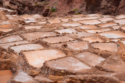 Inca ancient salt farm produced by evaporation in Peru