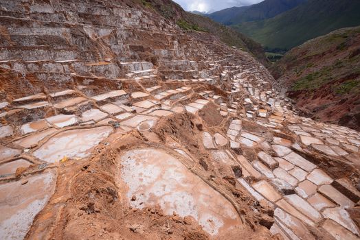 Inca ancient salt farm produced by evaporation in Peru