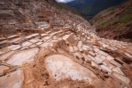 Inca ancient salt farm produced by evaporation in Peru