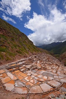 Inca ancient salt farm produced by evaporation in Peru