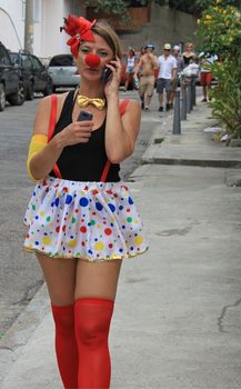 A young lady at a party on street in Rio de Janeiro, Brazil 01 Mar 2014 No model release Editorial only