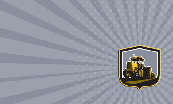 Business card showing illustration of a farmer driving riding vintage tractor plowing field front view set inside a shield crest done in retro style.