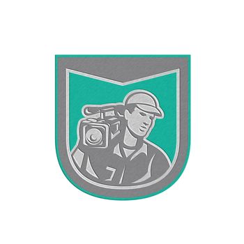 Metallic styled illustration of a cameraman film crew holding carrying hd video movie camera on shoulder set inside shield crest done in retro style on isolated backgrounbd.