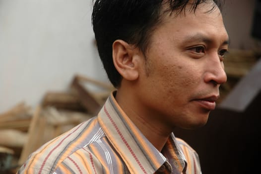 cikijing, west java, indonesia - july 10, 2011: man wearing casual shirt