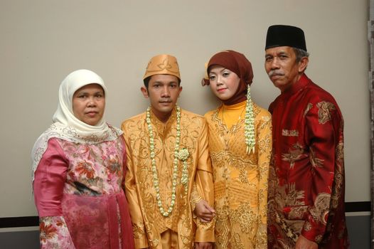cikijing, west java, indonesia - july 10, 2011: bride and groom wearing traditional west java wedding costume