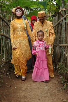 cikijing, west java, indonesia - july 10, 2011: bride and groom wearing traditional west java wedding costume