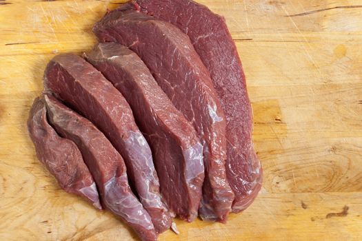 Detail of the slices of raw beef