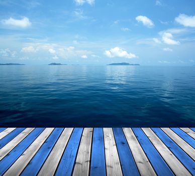 Ocean with sky and wood floor for background