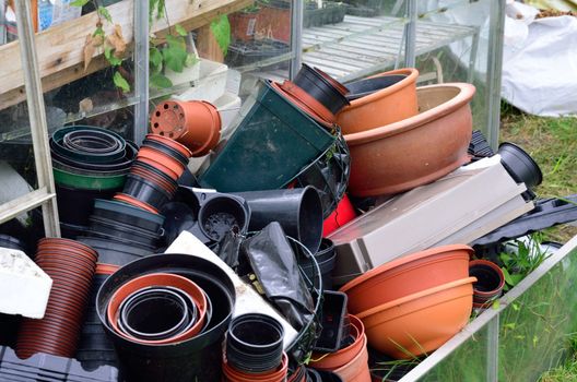 Large pile of empty plant pots