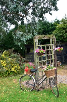 Bike with flowers in garden