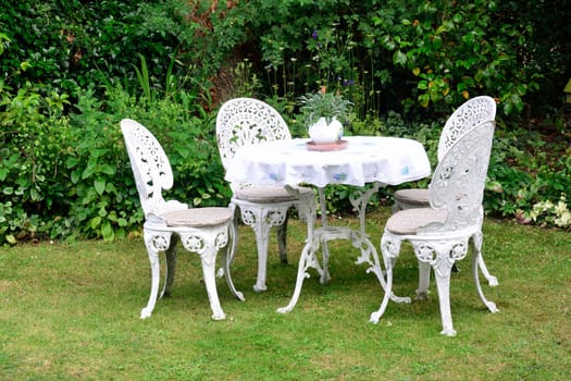 Whjite cast iron garden chairs