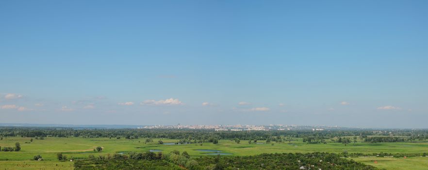 sunlit city on the horizon on a clear day 