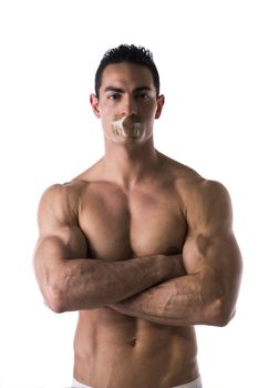 Muscular shirtless young man with duct tape on mouth cannot speak. Isolated on white