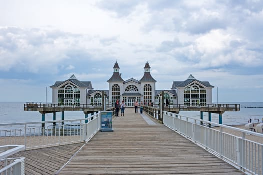 Sellin, Germany - June 23, 2012: Pier with historical house. A famous tourist attraction on the island of R�gen.