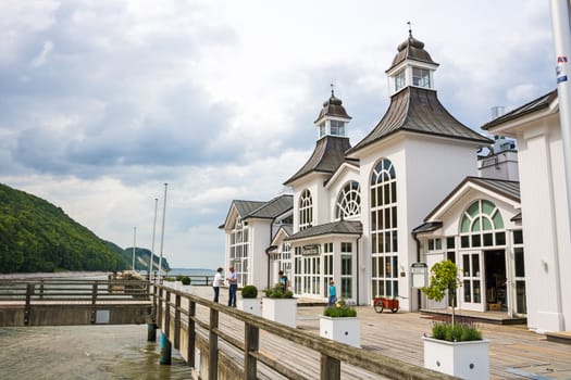 Sellin, Germany - June 23, 2012: Pier with historical house. A famous tourist attraction on the island of R�gen.
