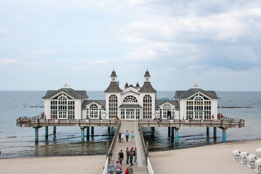 Sellin, Germany - June 23, 2012: Pier with historical house. A famous tourist attraction on the island of R�gen.