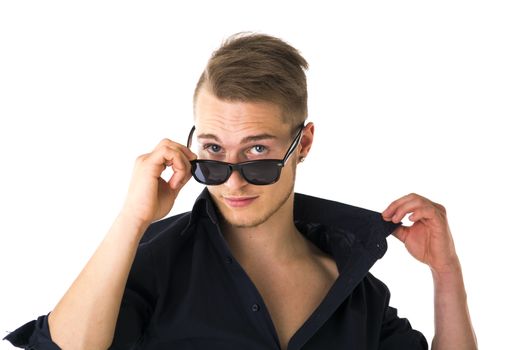 Cool confident blond young man with sunglasses and blue shirt, isolated on white