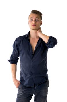 Cool confident blond young man with blue shirt and jeans, isolated on white