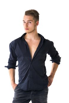 Cool confident blond young man with blue shirt and jeans, isolated on white