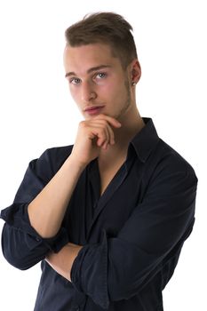 Serious confident blond young man with blue shirt looking at camera