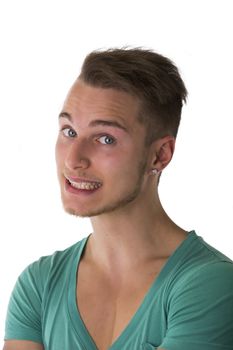 Attractive blond, blue eyed young man smiling and looking at camera, isolated