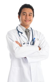 Portrait of confident southeast Asian male medical doctor smiling, standing isolated on white background. Young man model.